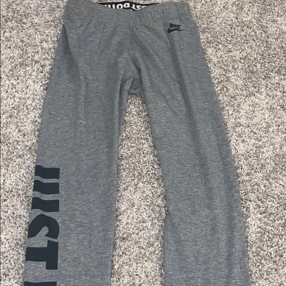 Grey Nike leggings with Just Do It written on side